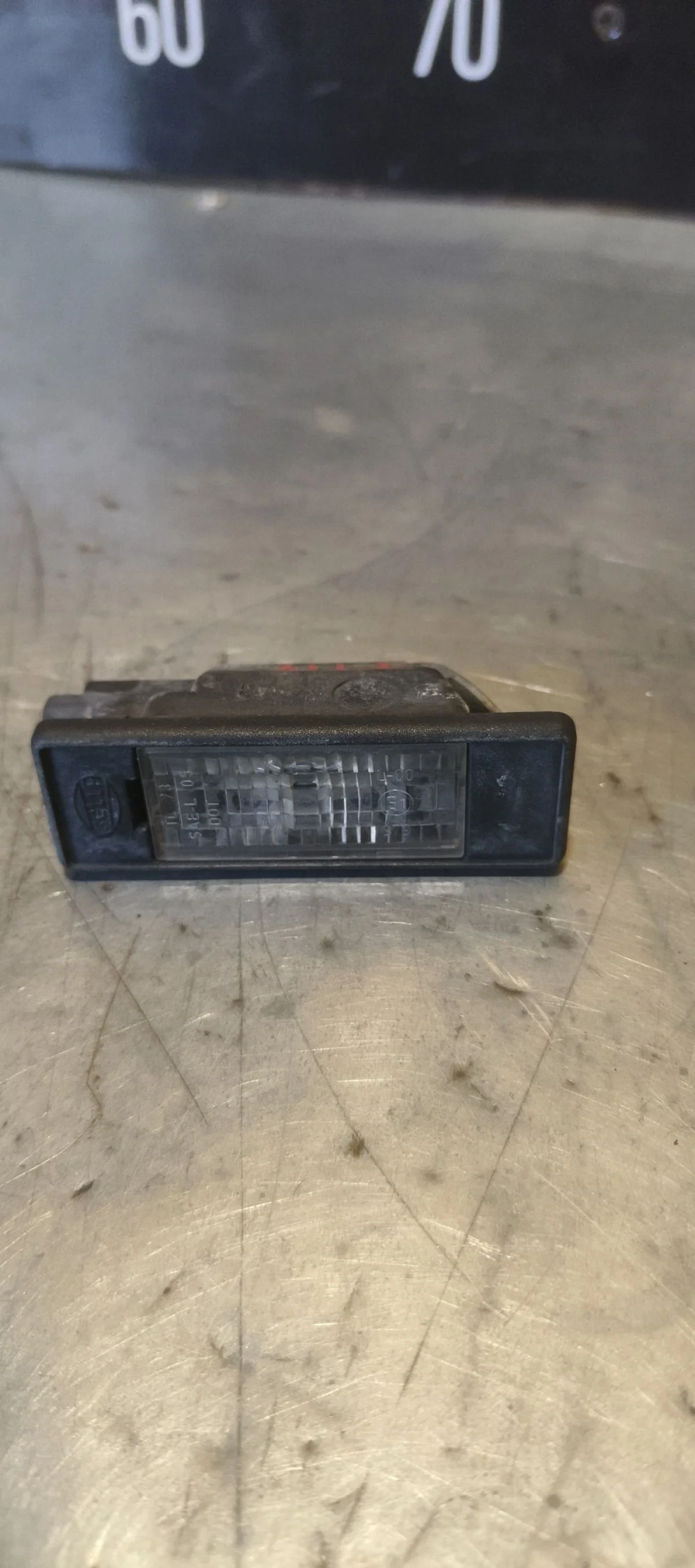 Фонарь подсветки номера Nissan Pathfinder III (2004—2010) 2008 B25 - GENUINE GRANITE