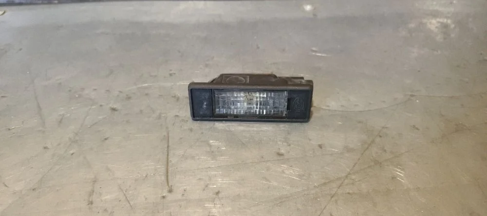 Фонарь подсветки номера Nissan Pathfinder III (2004—2010) 2008 B25 - GENUINE GRANITE