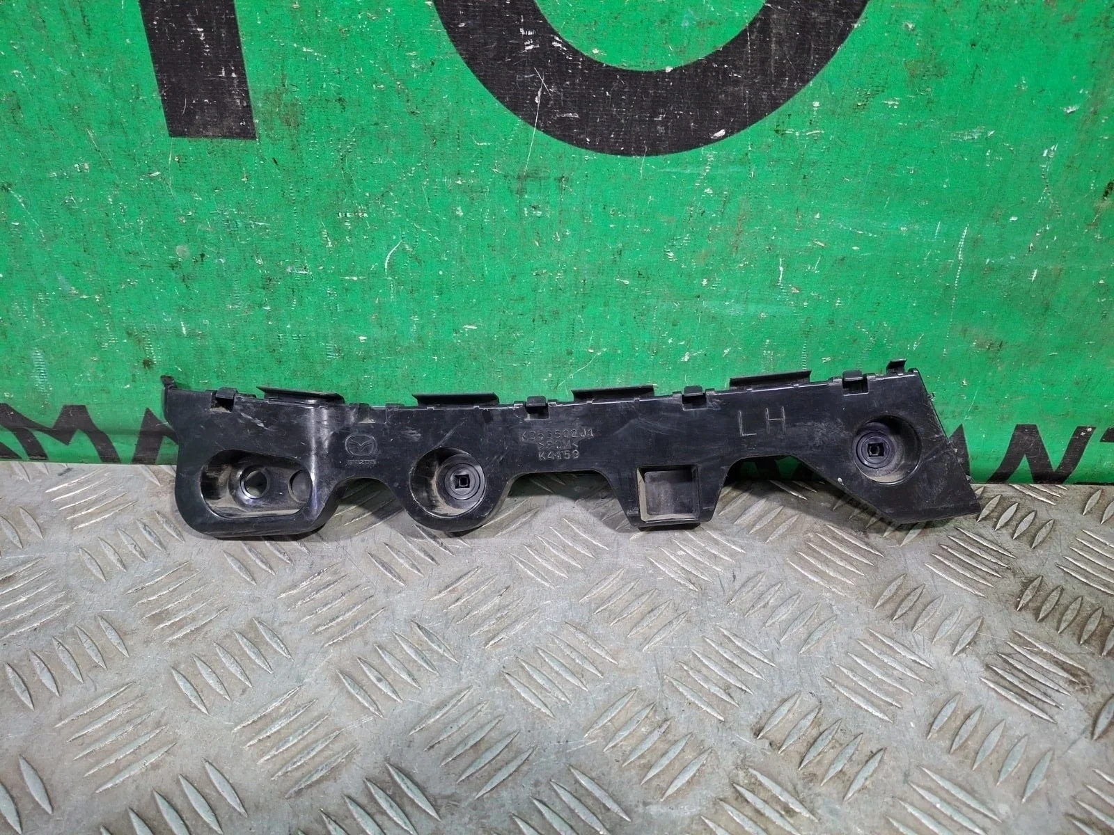 Кронштейн бампера Mazda CX-5 2011-2017 KD53502J1 1, задний левый
