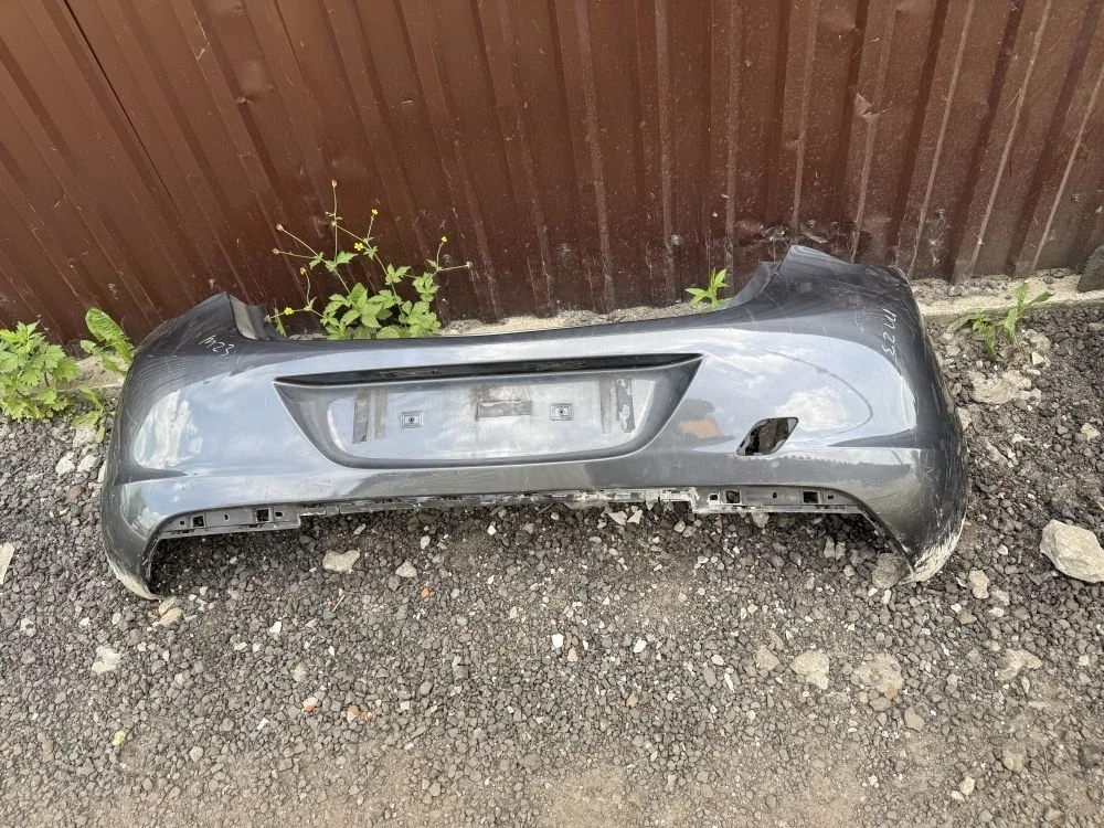 бампер задний opel astra j дорестаил