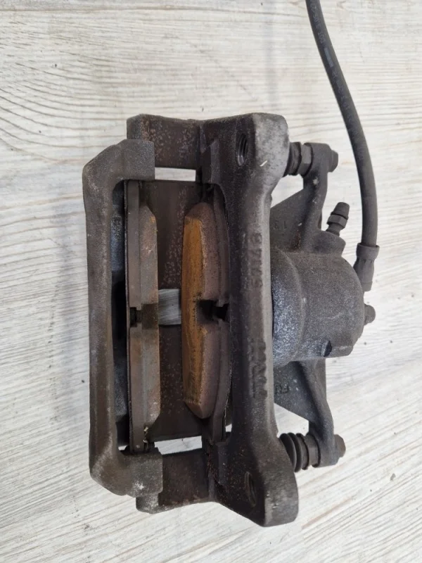 Суппорт тормозной VW Tiguan 2 2016- AD1