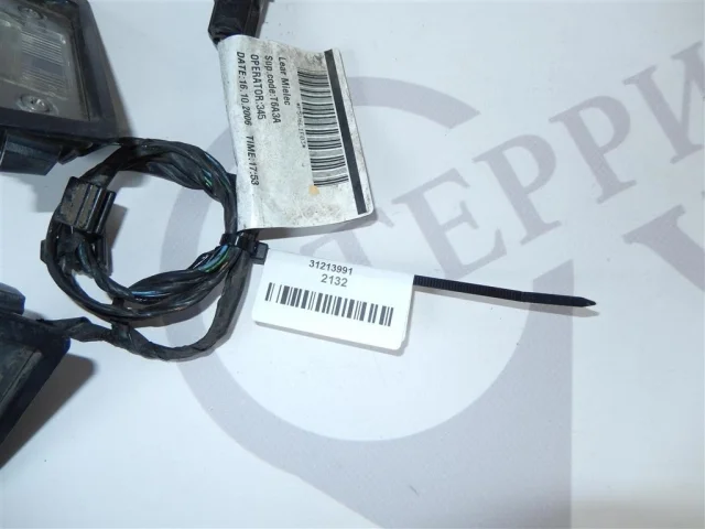 Фонарь подсветки номера левый для Volvo C30 MK 2006-2013 на фотографиях