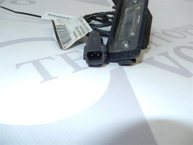 Фонарь подсветки номера левый для Volvo C30 MK 2006-2013 на фотографиях