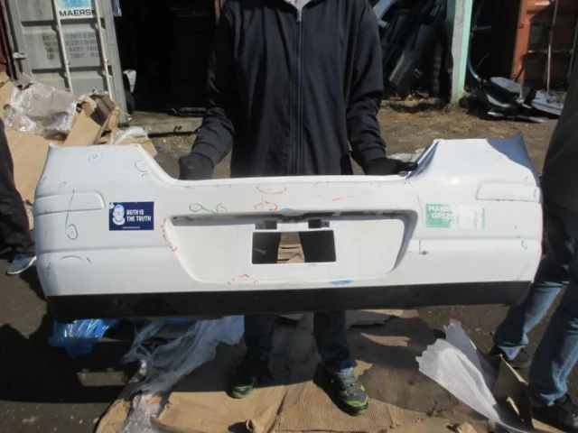 Бампер задний для Nissan Tiida SC11 Седан 2007-2014 на фотографиях