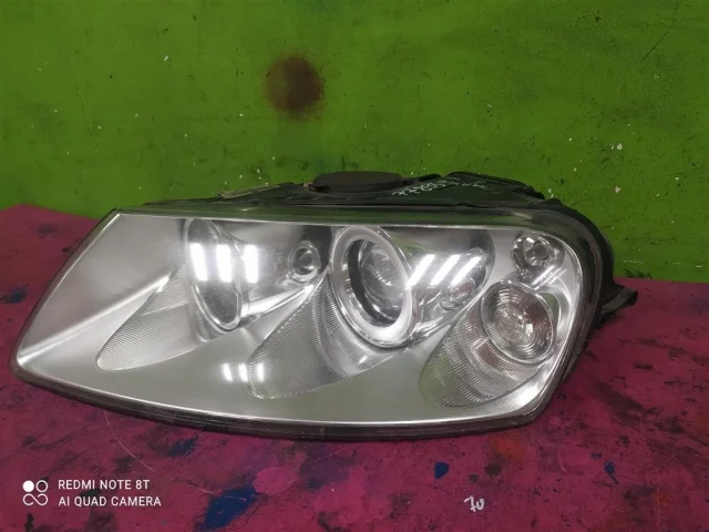 Фара ксенон левая для Volkswagen Touareg I (7L) 2002-2010 на фотографиях