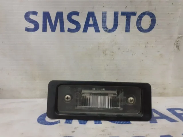 Фонарь подсветки номера левый для Volvo C30 MK 2006-2013 на фотографиях