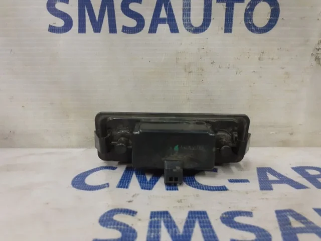 Фонарь подсветки номера левый для Volvo C30 MK 2006-2013 на фотографиях