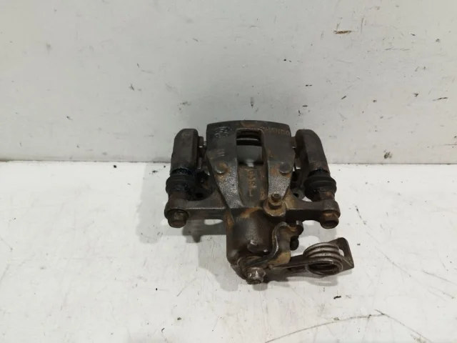 Суппорт задний левый для Hyundai Solaris 1 RB (2011-2013) на фотографиях