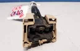 Форсунка фароомывателя левая для Mazda CX 5 2011 года на фотографиях