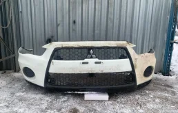 Бампер Mitsubishi Outlander XL 2009-2012 6400D090, передний