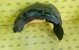 Подкрылок Opel Corsa 13187362 D, задний левый