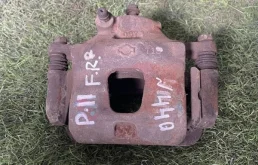 Суппорт тормозной Nissan Primera 410012F522 P11, передний правый