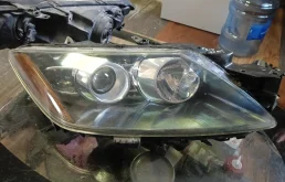 Фара галоген Mazda CX-7 2006-2012 E22151031E, правая
