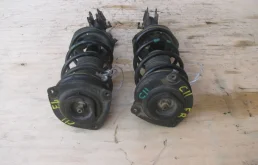 Амортизатор передний левый для Nissan Tiida на фотографиях