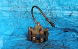 Суппорт передний левый для Suzuki Grand Vitara 2006 года на фотографиях