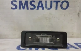 Фонарь подсветки номера левый для Volvo C30 на фотографиях